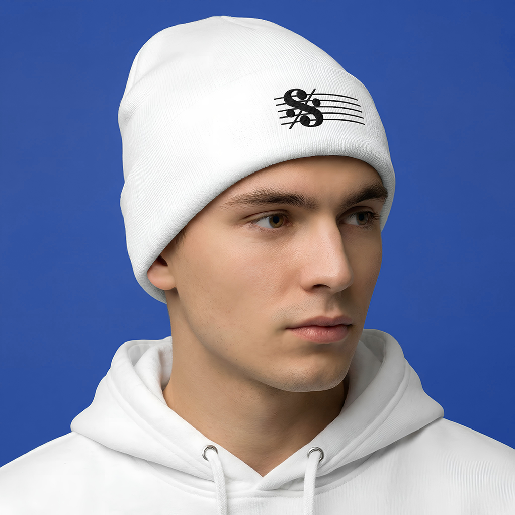 Person wearing a Typocrisy SEGNO White Embroidered white beanie with a logo and matching hoodie against a blue background