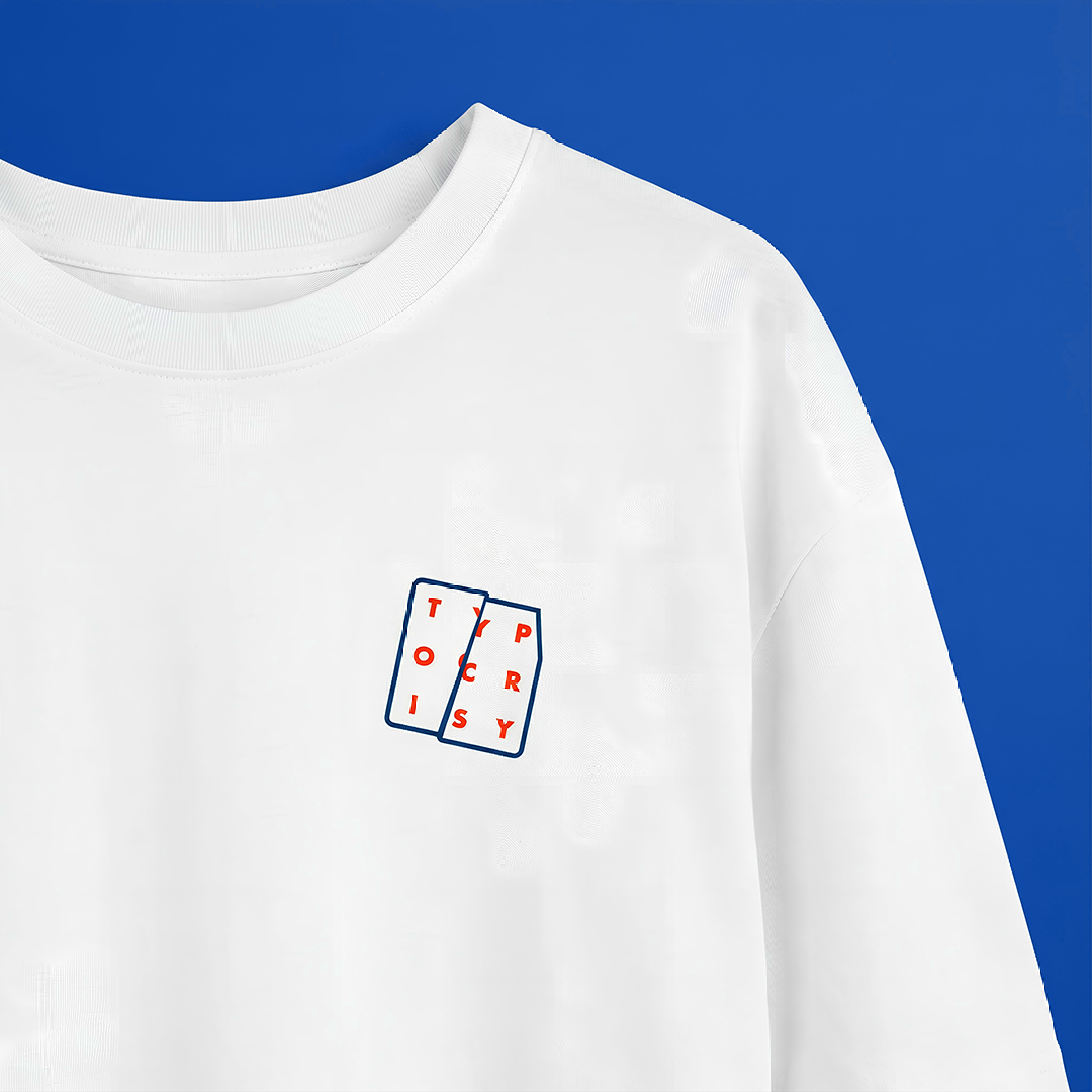Close-up of white Typocrisy Dont Talk t-shirt chest, split-panel logo graphic in navy and red